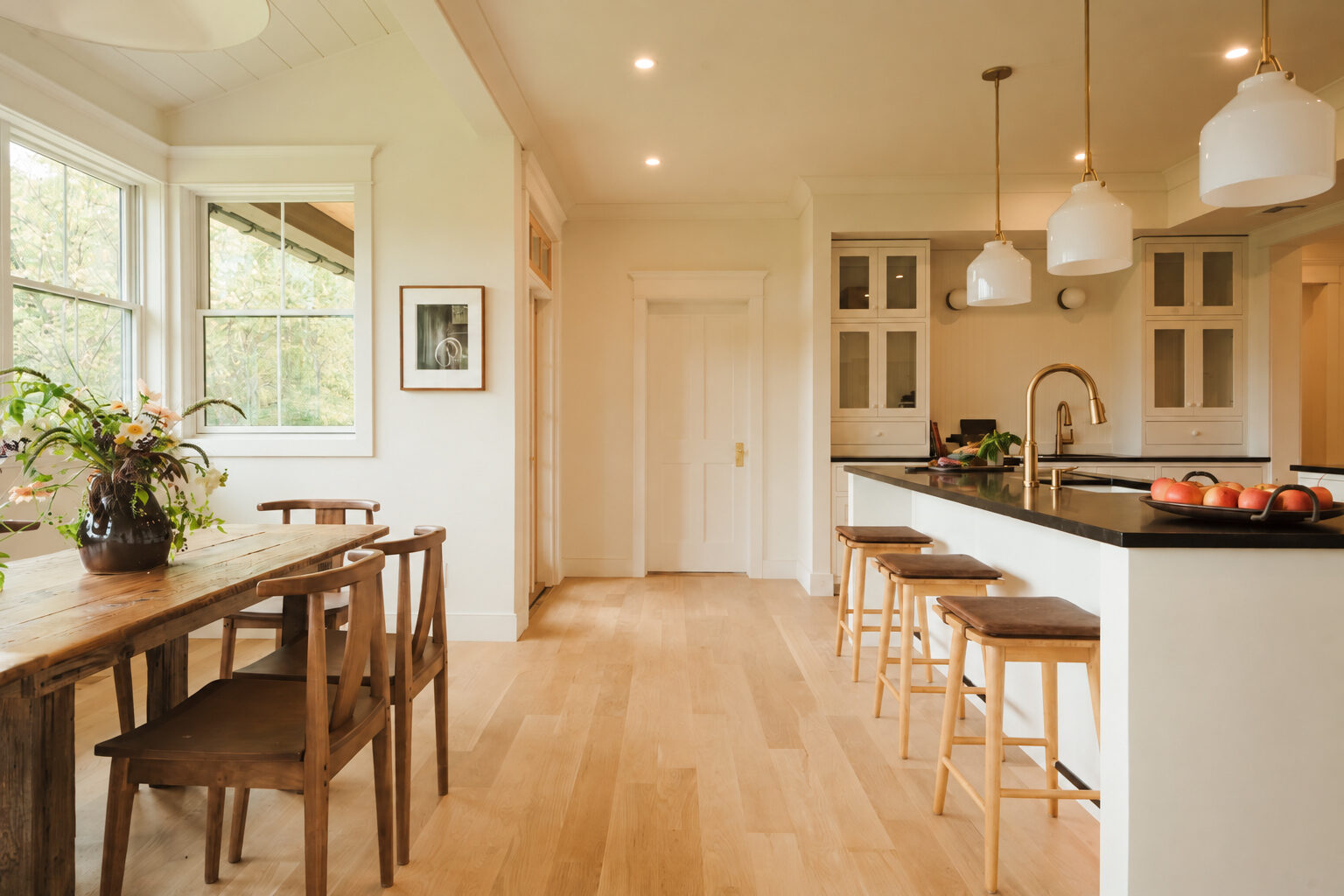 Hemlock House — kitchen with soapstone counters, island seating and dining area